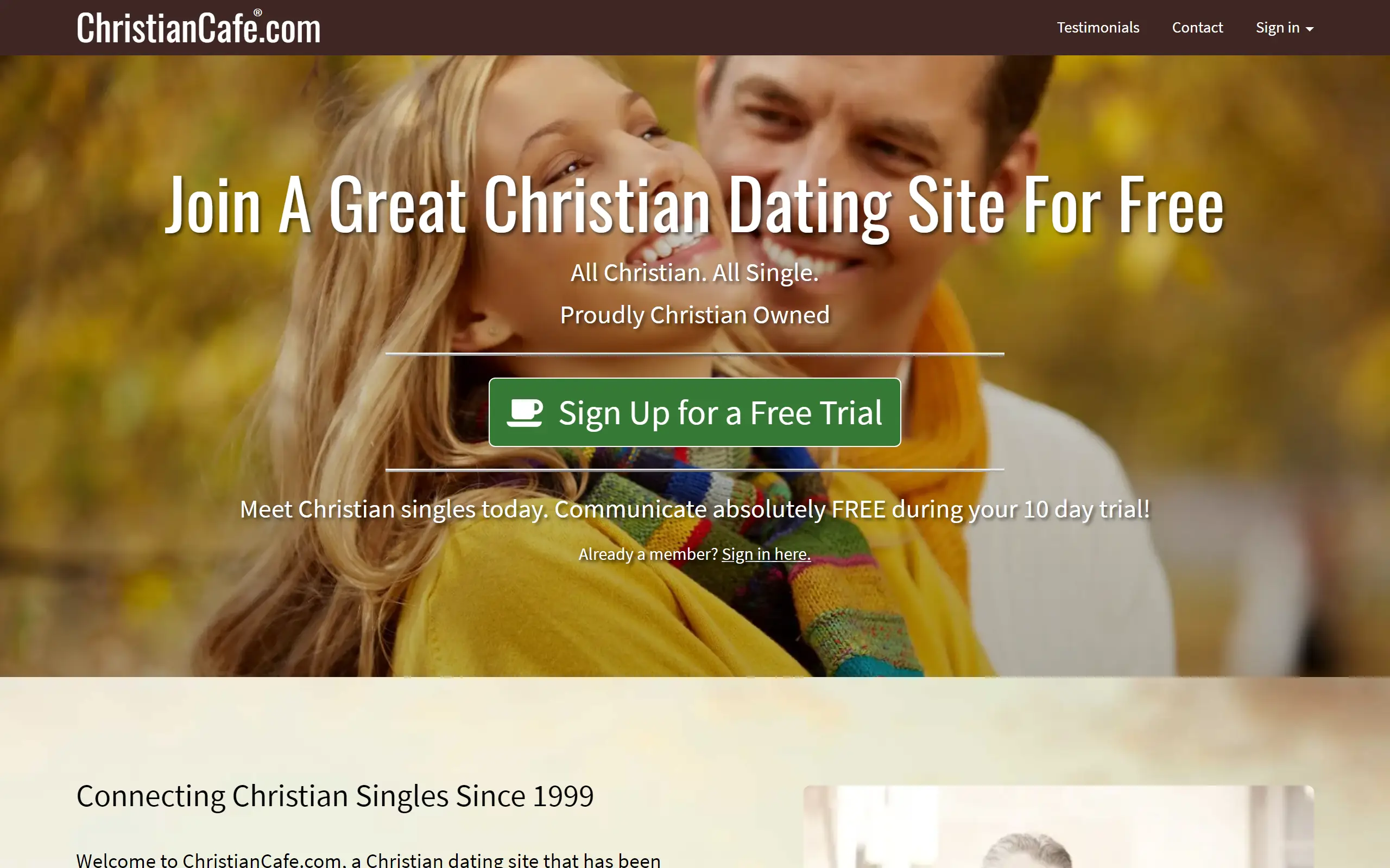 Christian Cafe dating site homepage featuring a Christian couple in winter clothing while it snows.